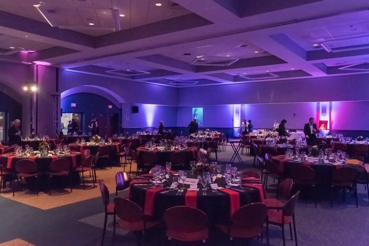 NHSO Gala at the Adanti Student Center. There is mood lighting and large circular tables throughout the room.